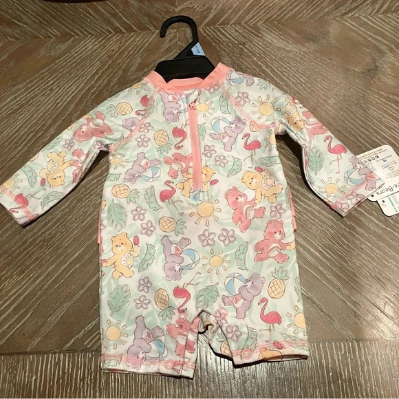 NWT Care Bears Swim Rash Guard Onesie with Ruffle Bottom 50+ UPF (3-6 Months) - Picture 1 of 5